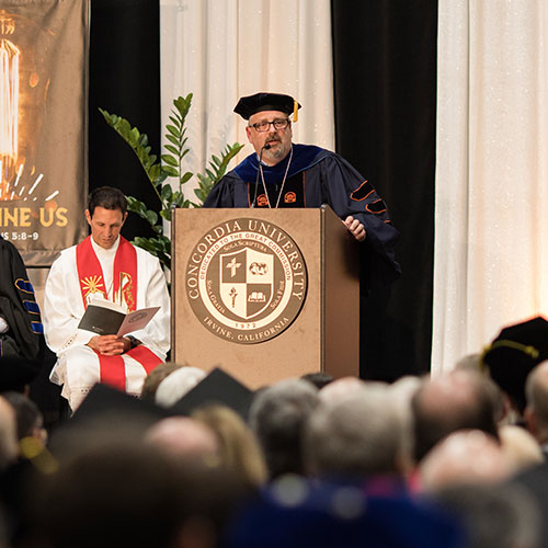 President Thomas at the podium